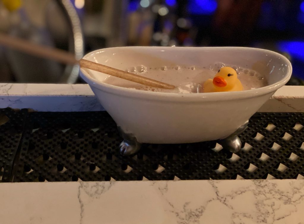 Speakeasy crafted cocktail - Bathtub Gin with a rubber ducky served at Mathers in Orlando.
