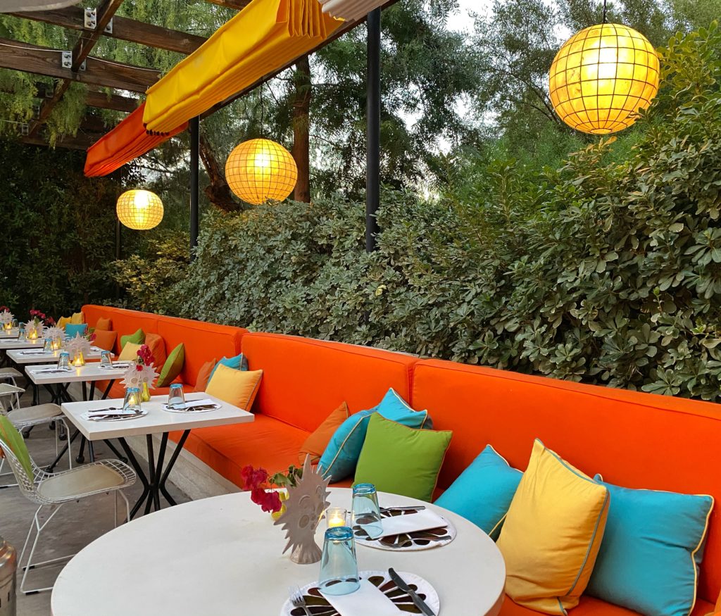 Colorful mid-century design outdoor patio brunch at Norma's at the Parker Palm Springs Hotel.