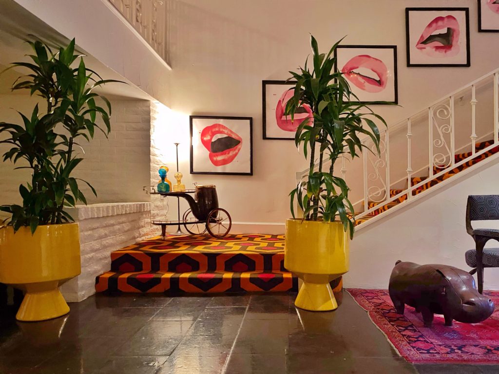 Bohemian decorating with lip artwork ascending the stairs at the Parker Palm Springs.
