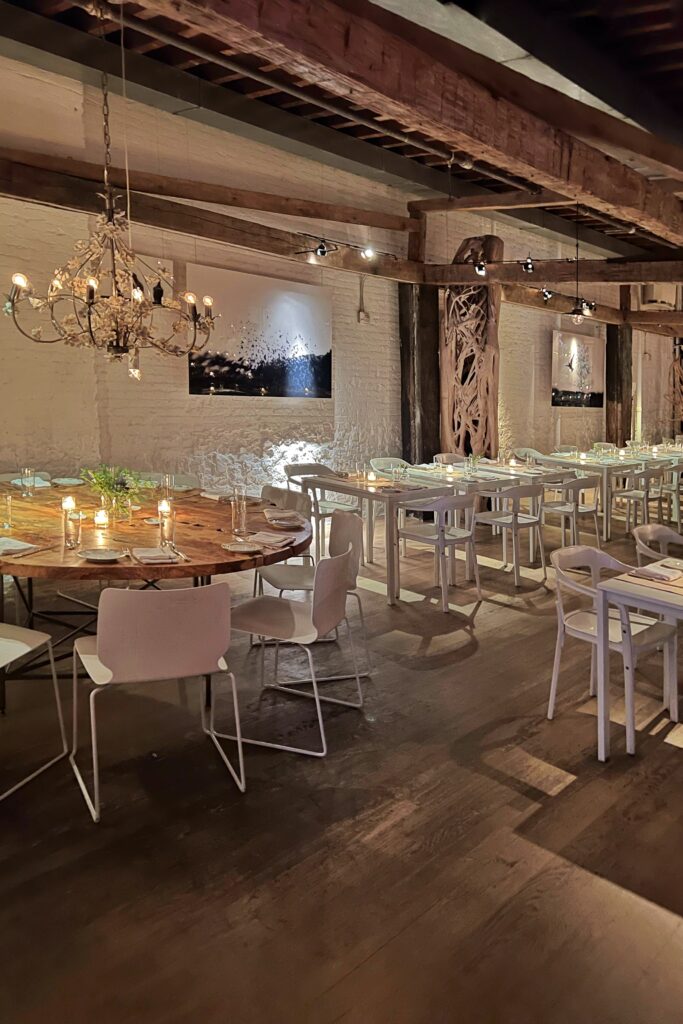 ABC Kitchen restaurant chandelier and rustic beams.