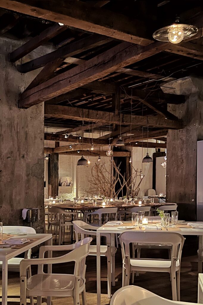 ABC Kitchen restaurant with rustic rafters and white decor