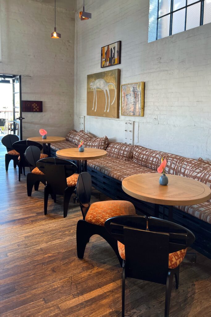 Luxury hotel in dowtown Los Angeles, banquette seating at the Cara Cara rooftop bar.