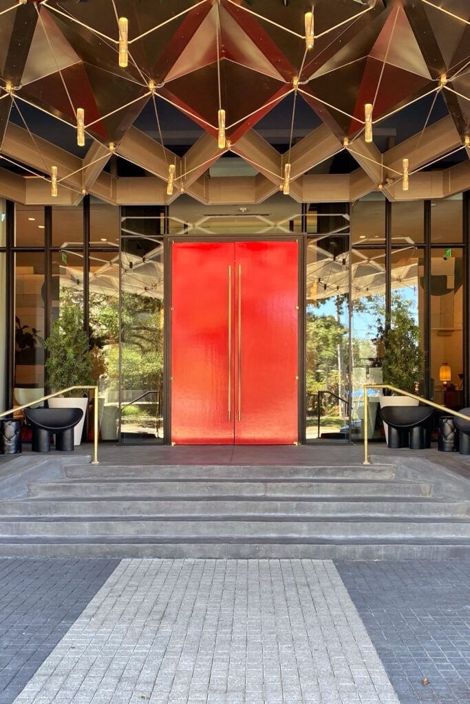 Bright red front door at the Virgin Hotel Dallas