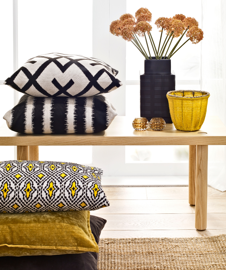 Collection of home decor throw pillows showing how impulse buys can wreck your interior design style.
