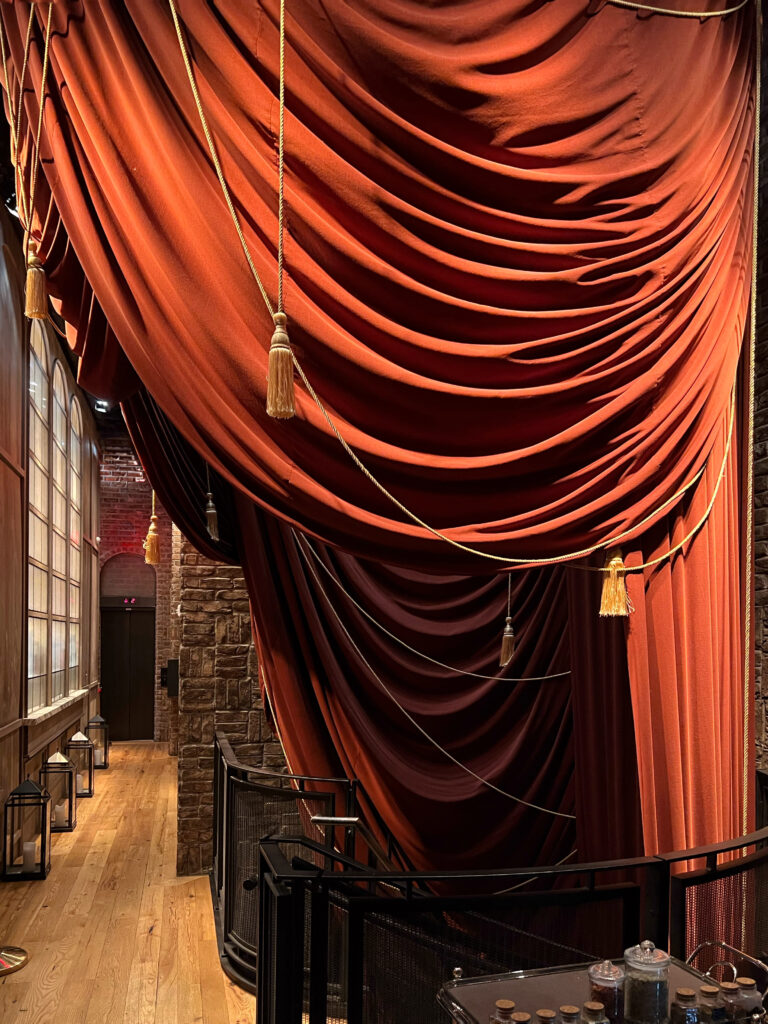 Dramatic red drapery with tassels inside the Civilian Hotel, one of New York City's most aesthetic spaces.