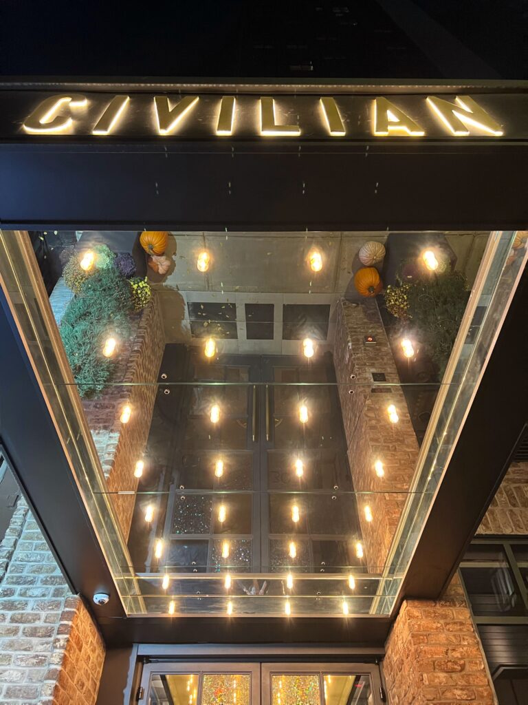 Marquee lighting and backlit Civilian logo at the entrance to the hotel - that's one of New York City's most aesthetic spaces.