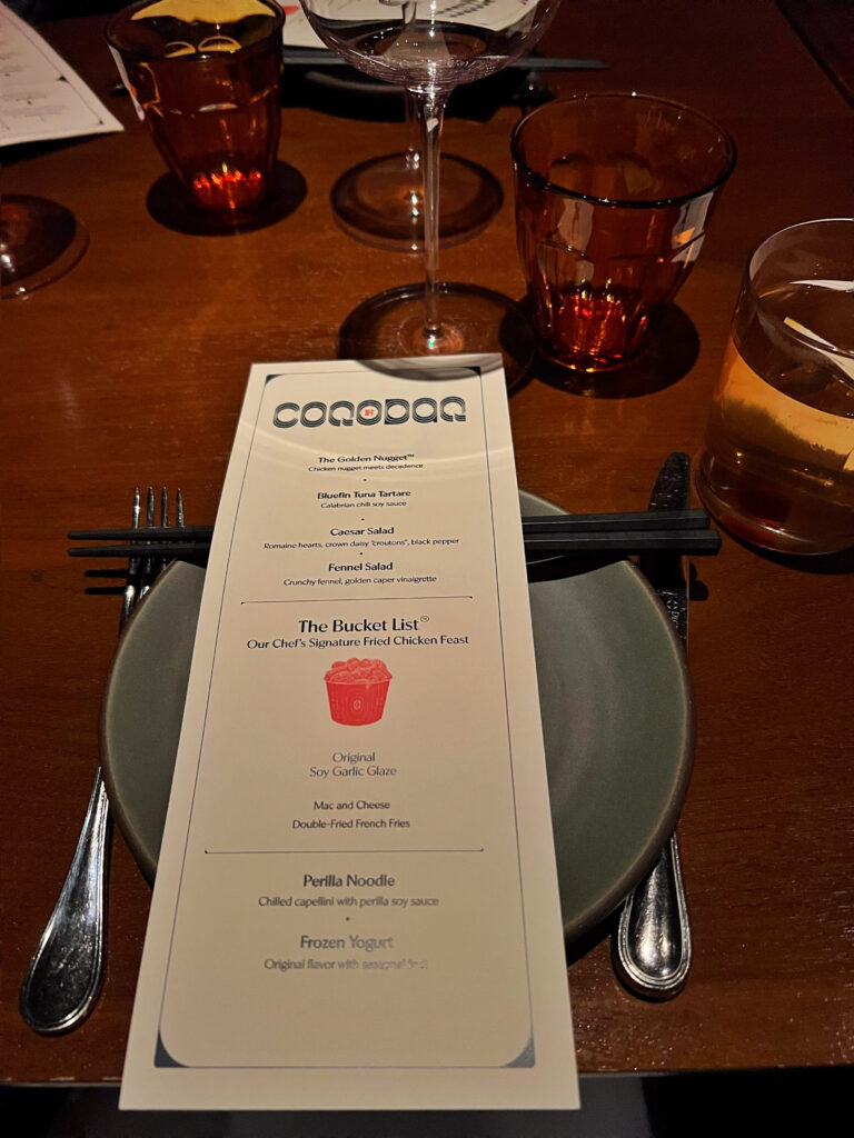 The menu at Coqodaq restaurant featuring The Bucket LIst and Korean fried chicken.