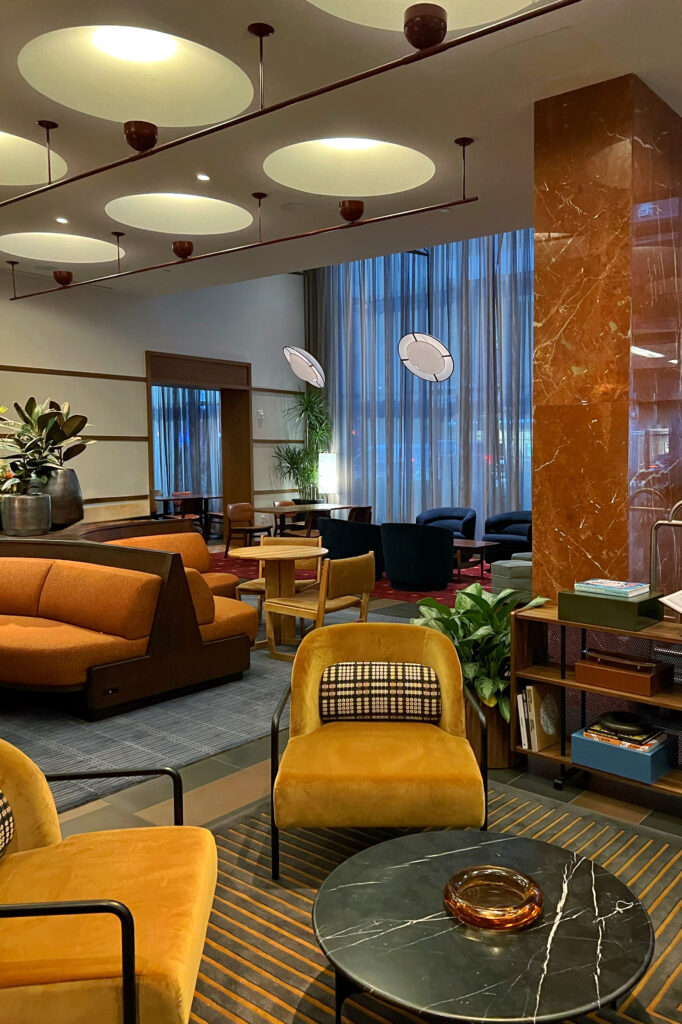 Lobby of the Romer Hells Kitchen Hotel with lounge seating and architectural lighting, one of New York City's most aesthetic spaces.