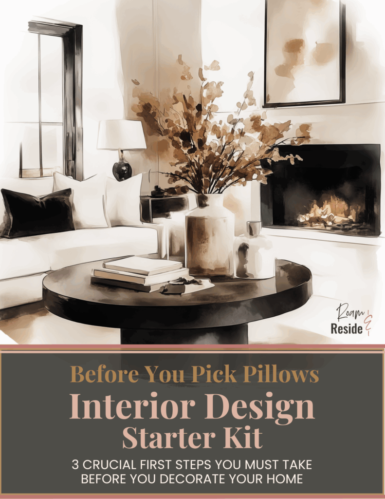 Interior Design Starter Kit digital guide cover displayed on tablet, featuring a modern neutral living room with cozy sofa, black accent pillows, round coffee table, fireplace, and styled florals — promoting ‘Before You Pick Pillows: 3 Crucial First Steps You Must Take Before You Decorate Your Home.’