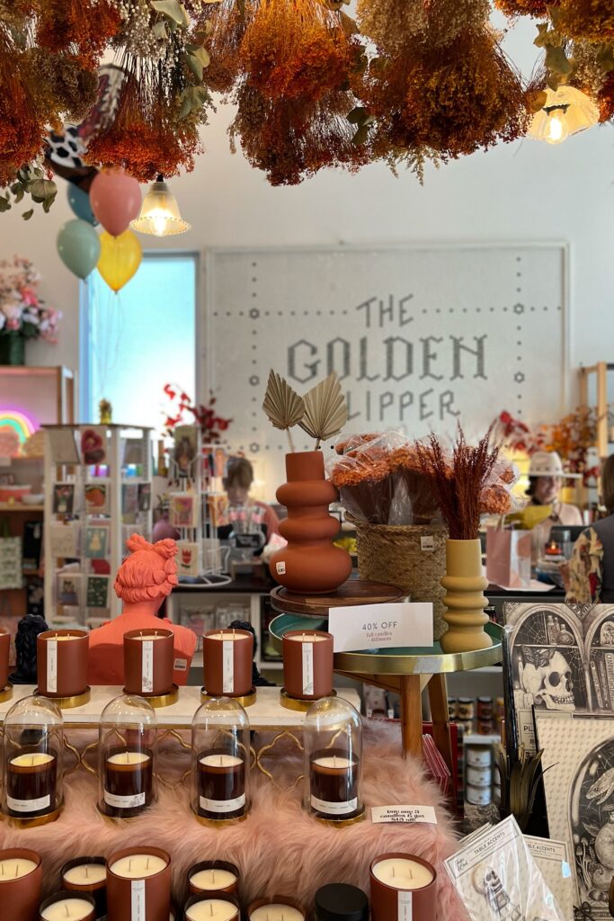 Golden Slipper retail boutique in Nashville featuring candles, vases, and hanging ceiling floral decor — a must-visit stop in the Nashville Aesthetic Travel Guide.