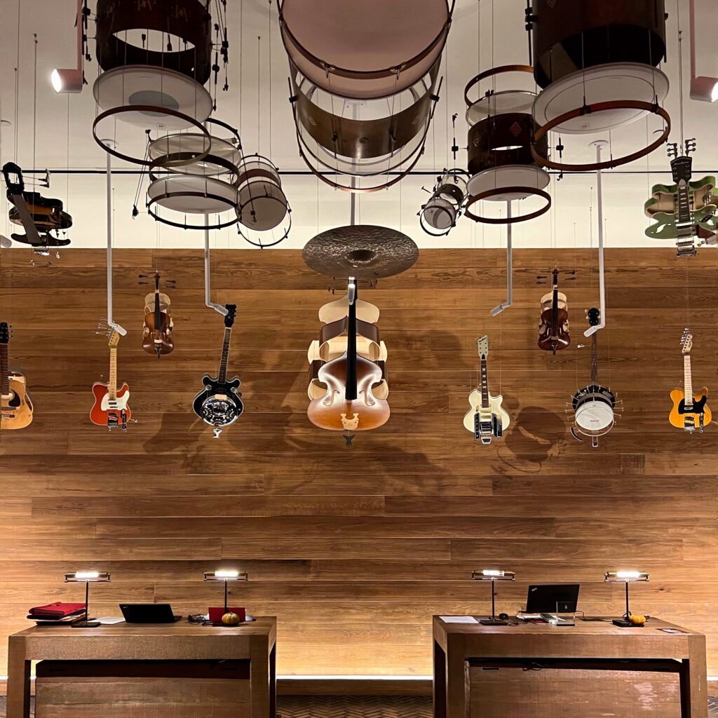 Lobby of Virgin Hotel Nashville with guitars, violins, and drums suspended as art installation — a bold music-inspired welcome in the Nashville Aesthetic Travel Guide.