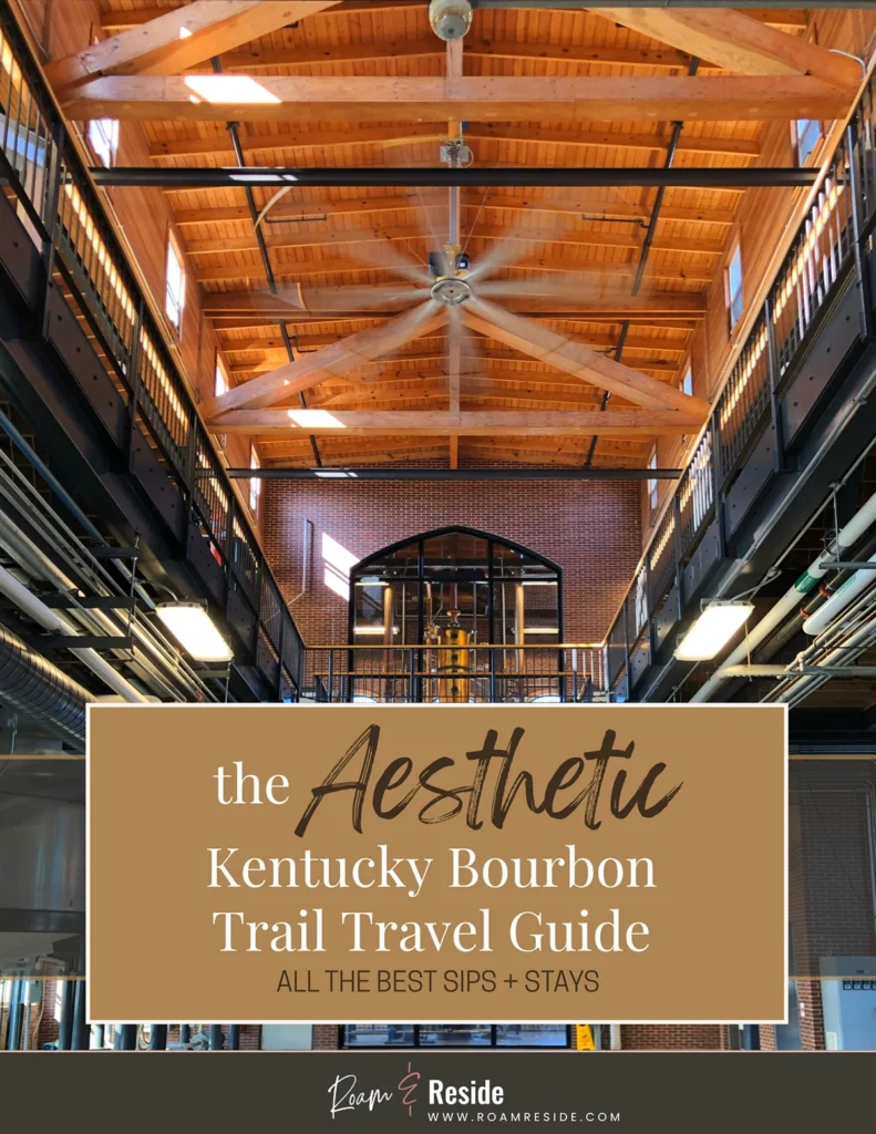 Best Aesthetic Hotels on the Bourbon Trail. Cover of a free “Aesthetic Kentucky Bourbon Trail Travel Guide” download featuring a vaulted distillery interior with exposed wood beams and a large ceiling fan. Includes the subtitle “All the best sips + stays” and Roam & Reside branding, designed for planning a Kentucky Bourbon Trail itinerary in Louisville, Lexington, and beyond.